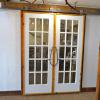 French doors with White Cedar border hung on rail. Using rollers from the old barn. February 2018