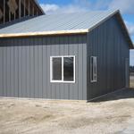 Great week, siding and installed door on the east side of building. 2/16/13