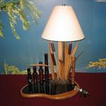 This lamp is an original Starlight Studio design. Resin water on  inlayed wood base to place a  prized decoy.  Bar-ins (tm) pins used to hold the buyers personnel collection of duck and goose calls.