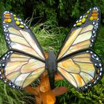 Monarch Butterfly on rust metal Milkweed base.