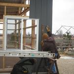 First sheet up of metal siding up. It is amazing how much work there is before the siding can be put on the building. J trim,  windows in and trimmed out with drip trim on top, etc. 2/8/13